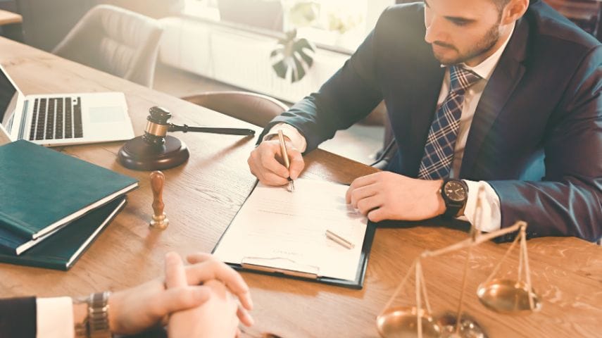 Lawyer reviewing legal documents at desk